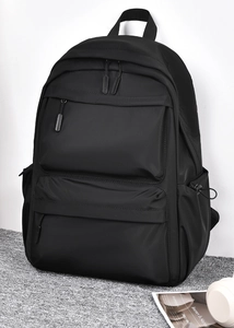 Front view of black water-resistant nylon backpack with multi-layer zipper compartments