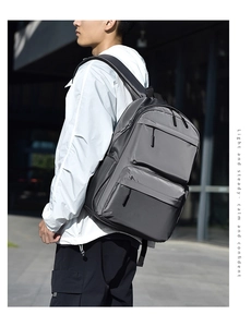 Detail of gray waterproof nylon backpack with smooth texture and side water bottle pocket