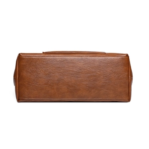 Bottom view of brown PU leather tote bag with detailed stitching and soft texture