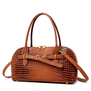 Brown crocodile embossed leather Boston handbag with gold hardware and shoulder strap