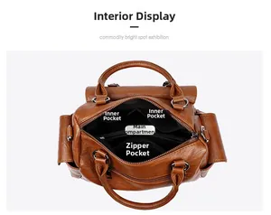 Vue détaillée de l'intérieur spacieux avec poche zippée dans le sac en cuir marron