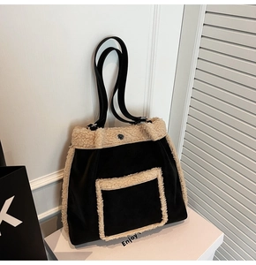 Detail view of the lamb wool tote bag with beige fuzzy trim and black velvet texture