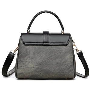 Elegant black and grey two-tone leather tote bag with gold hardware and detachable strap
