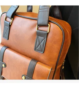 Close-up of vintage brown PU leather backpack with bronze metal buckles and grain texture