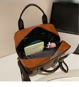 Detail view of large capacity vintage brown leather backpack with spacious interior
