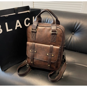 Detailed view of dark brown PU leather vintage backpack with adjustable straps and top handle