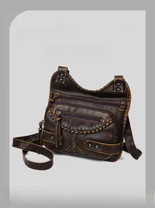 Close-up of vintage brown washed leather bag with multi-zipper and rivet details