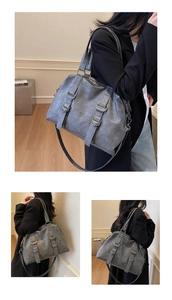Detail of gray vintage tote bag with metal D-rings and textured soft leather finish