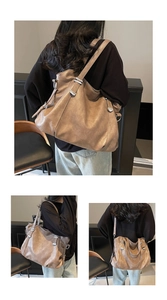Detail view of large coffee brown tote bag showing soft pleated texture and silver buckles