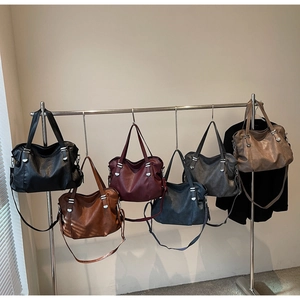 Detailed collection of six solid color vintage tote bags with adjustable straps
