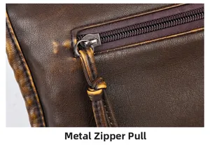 Macro view of vintage brown leather texture and metal hardware zipper puller