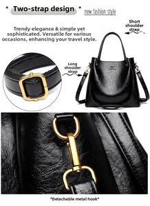 Detail view of black oil wax leather handbag with golden hardware and kangaroo logo