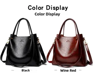 Detail view of large tote bags in black and wine red featuring kangaroo logo and texture