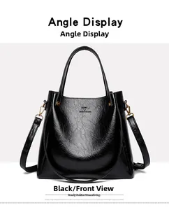 Front view of black tote bag with glossy finish and kangaroo metal logo detail