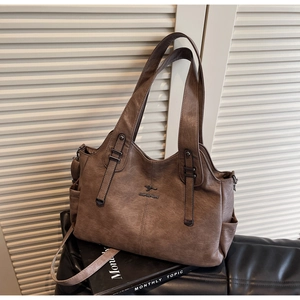 Close-up of brown faux leather tote bag with lychee texture and kangaroo logo