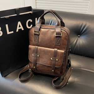 Classic dark brown vintage backpack in textured PU leather with metal buckles and front pocket