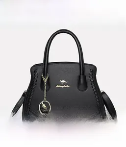 Front view of black lychee grain leather handbag with gold kangaroo charm and woven details