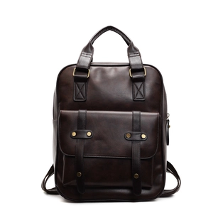 Classic vintage dark brown faux leather backpack with large front flap pocket and brass studs