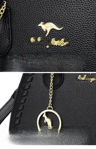 Detail of black lychee grain leather handbag featuring golden kangaroo logo and hardware