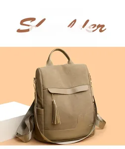 Close-up of brown corduroy backpack featuring tassel flap and cute rabbit leather patch