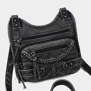 Vintage black washed leather crossbody bag with multiple pockets and stud accents
