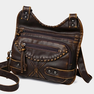 Retro dark brown leather crossbody bag with multiple zippers and woven trim detail