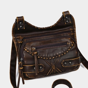Vintage dark brown washed faux leather crossbody bag with multi-zipper pockets and rivets