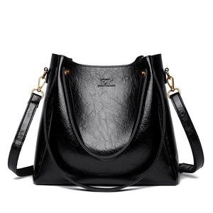 Minimalist black large capacity tote bag in glossy textured leather with top handles