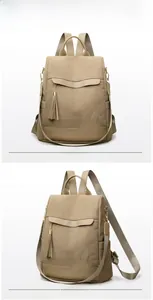 Front and side view of khaki corduroy backpack with rabbit embroidery and tassels