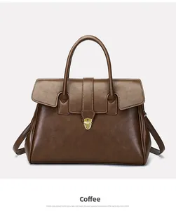 Detailed macro view of the coffee brown faux leather texture and golden twist lock