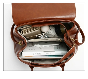 Top view of spacious brown PU leather tote bag interior with organized daily essentials