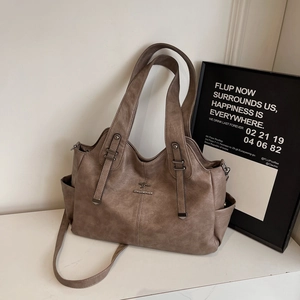 Retro brown leather tote bag for women with kangaroo logo and adjustable strap