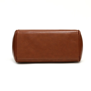 Bottom view of large brown vintage tote bag with high-quality leather texture and stitching