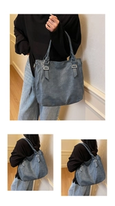 Close-up of vintage textured blue-grey leather tote bag with silver buckle and long handles
