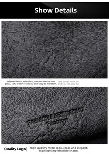 Detail showing high-quality black litchi grain leather texture and embossed logo on bag