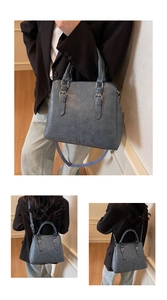 Detailed view of misty blue vintage textured crossbody bag with double handles and strap