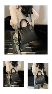 Lifestyle view of a vintage black lychee leather handbag with silver buckles and strap