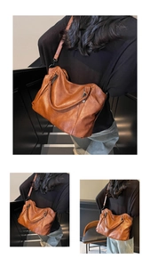 Detail of soft brown leather tote showing fine grain texture and adjustable shoulder strap