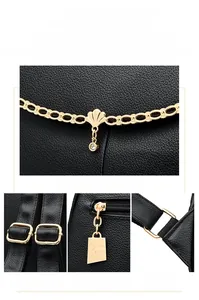Detail of light gold hardware with rhinestone chain and adjustable strap on leather backpack