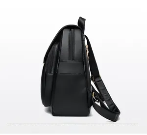 Side view of black leather backpack showing thickness, texture and golden zippers