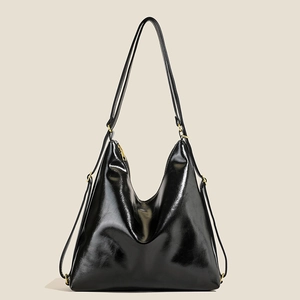 Glossy black leather tote bag with gold hardware and large capacity for daily use