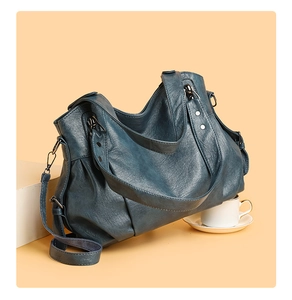 Detail view of large navy PU leather tote bag with zip closure and adjustable wide strap