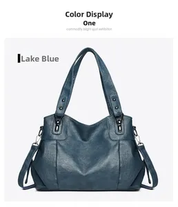 Detail view of the Lake Blue tote bag showing the vintage textured leather and hardware