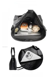 Aménagement intérieur du grand sac fourre-tout noir avec plusieurs compartiments et rangement