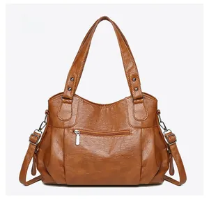 Rear view of vintage brown PU leather tote bag featuring a horizontal zipper pocket