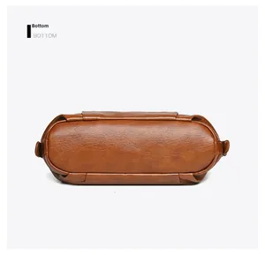 Detailed bottom view of large caramel PU tote bag featuring premium lychee texture
