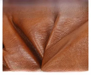 Close-up of caramel brown pebble grain PU leather showing soft texture and fine details