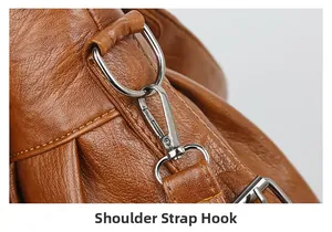 Detailed close-up of brown PU leather shoulder strap with silver detachable metal hook