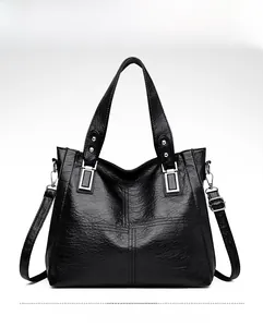 Vue frontale du sac cabas en cuir PU noir avec coutures décoratives et détails en métal argenté