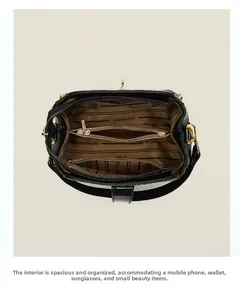 Top view of handbag interior showing three compartments with brown striped lining